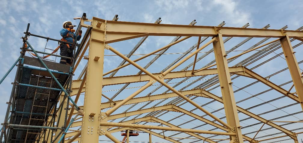 Engineers working on structural assembly